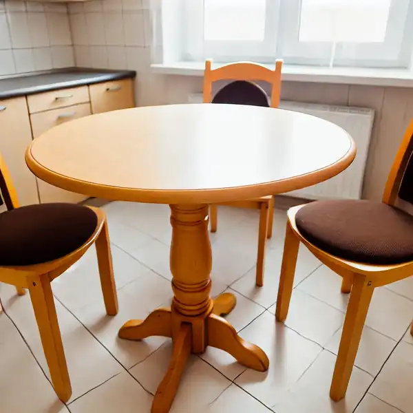 A round kitchen table in a cozy small kitchen